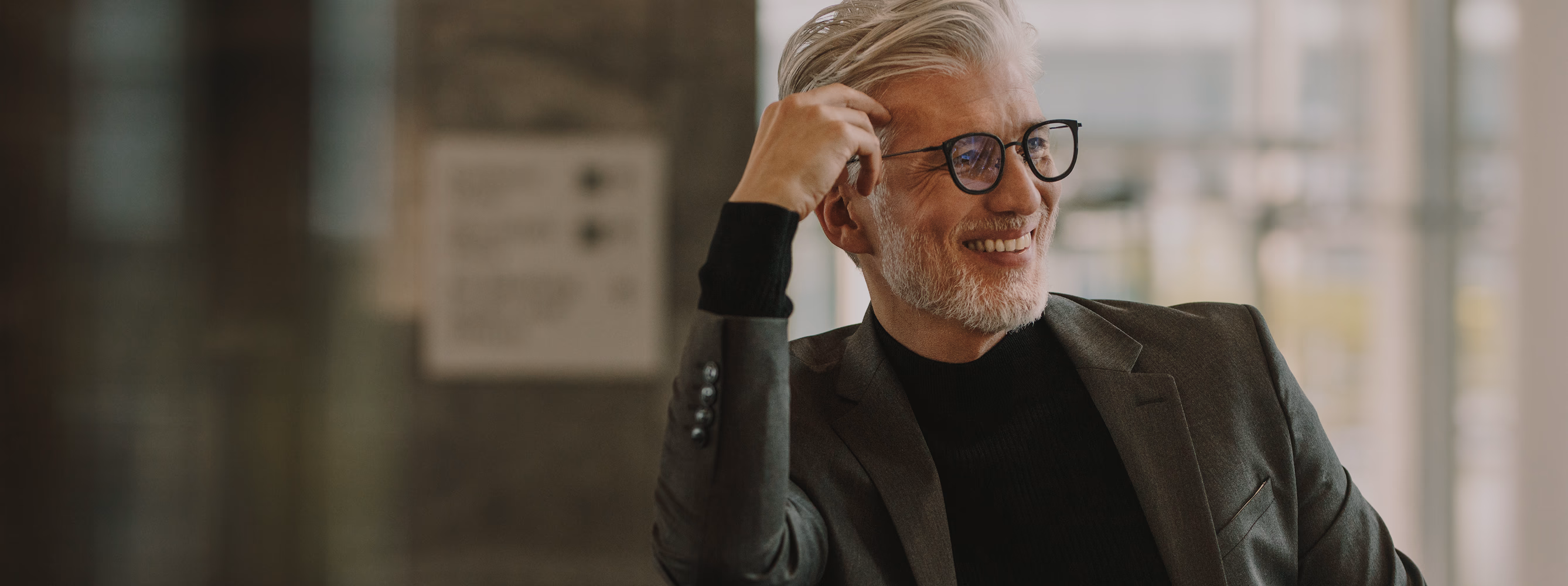Professional older gentleman with glasses smiling